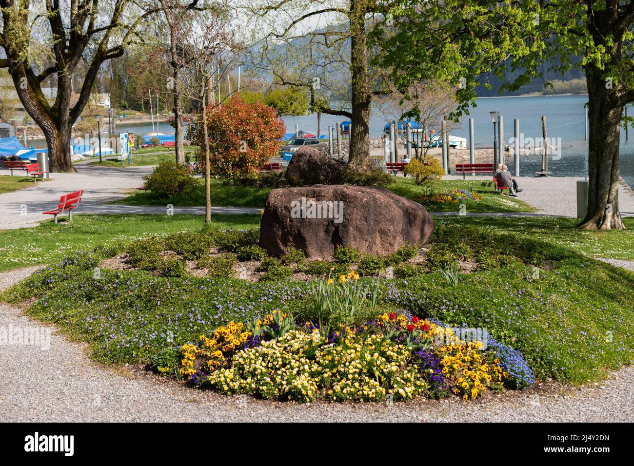 Walensee Spring Weesen, Switzerland, April 13, 2022 Pretty park at the coast of the ...