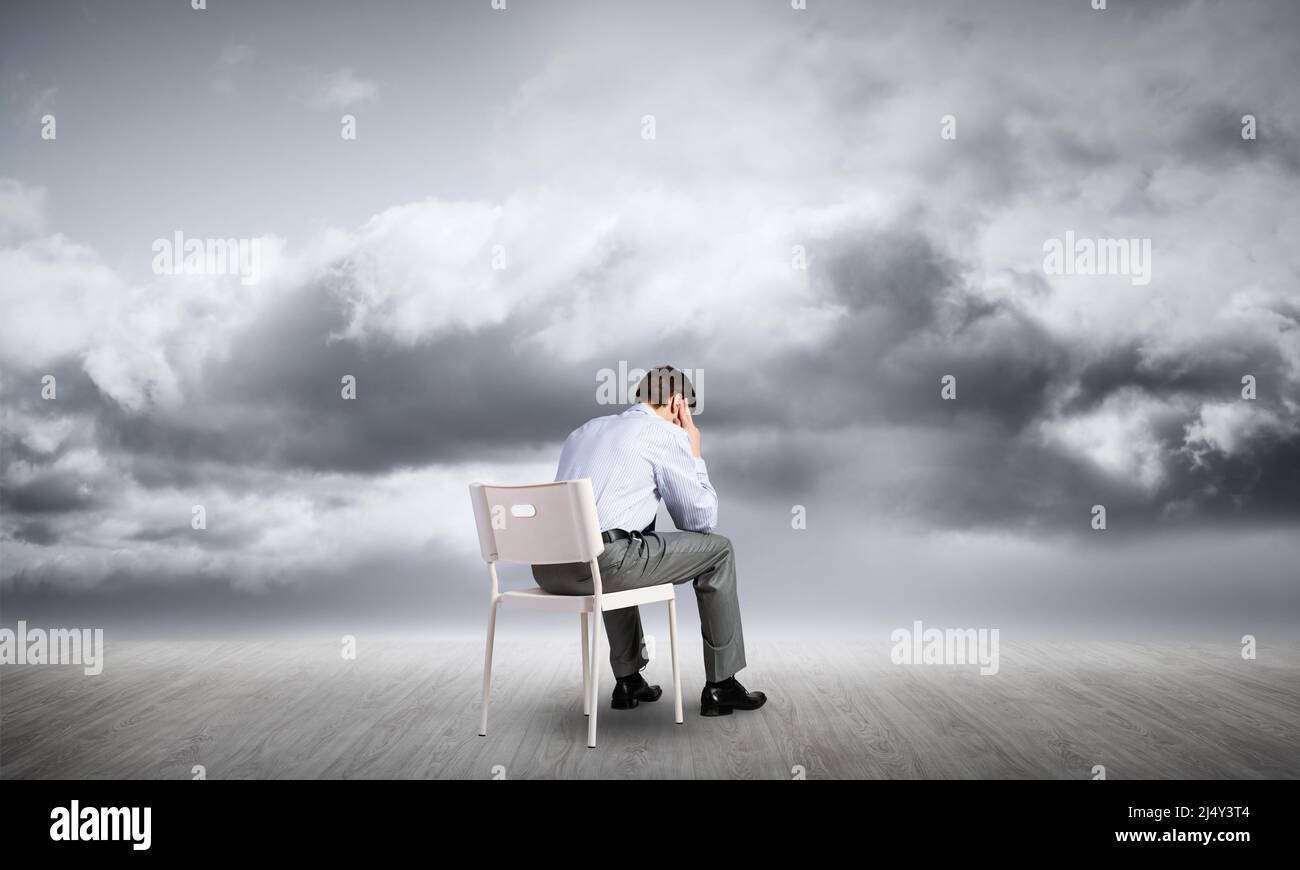 Businessman sitting on an office chair Stock Photo - Alamy