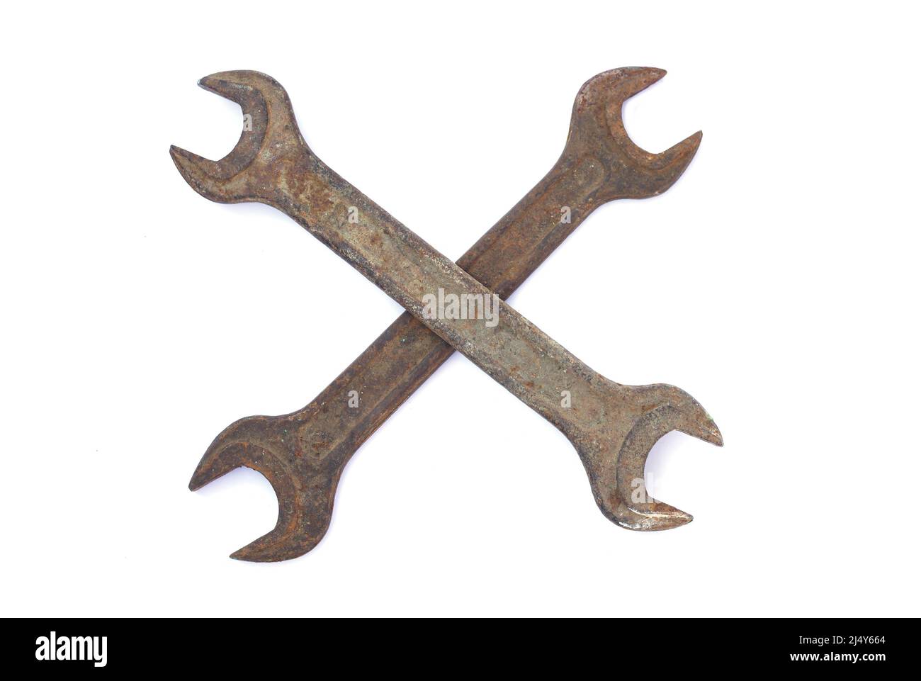 Two old rusty crossed wrenches isolated on white background Stock Photo
