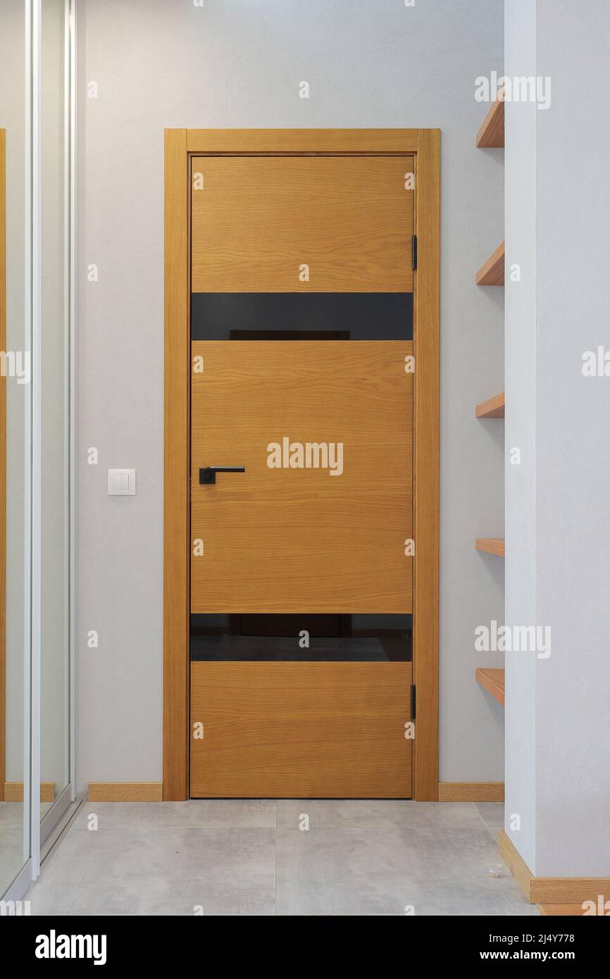 Brown wooden interior door in a modern interior Stock Photo Alamy