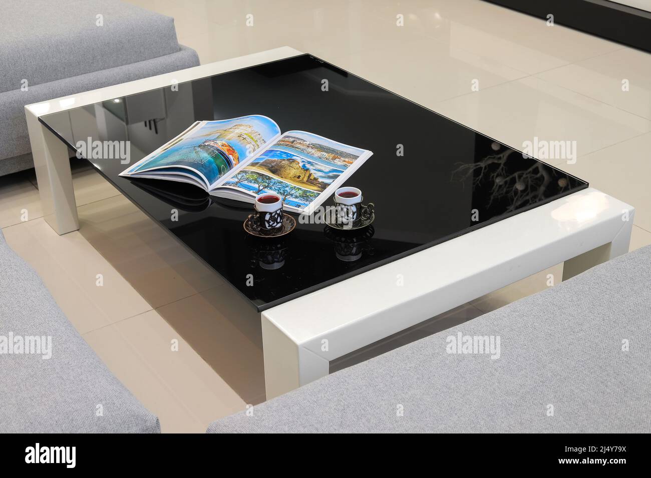 Modern coffee table in the interior Stock Photo - Alamy