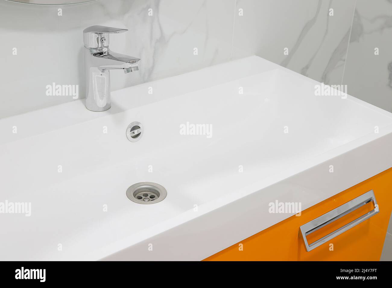 Modern white bathroom sink with faucet Stock Photo Alamy