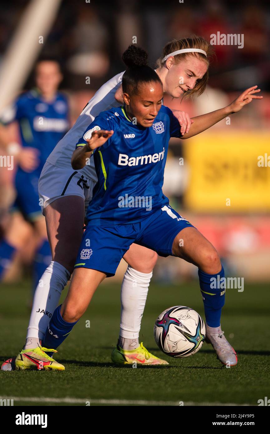 Leverkusen, Germany. 18th Apr, 2022. Soccer, Women: DFB Cup, Bayer Leverkusen - Turbine Potsdam, semifinal, Ulrich Haberland Stadium. Leverkusen's Amira Arfaoui (l) and Potsdam's Karen Holmgaard fight for the ball. Credit: Marius Becker/dpa - IMPORTANT NOTE: In accordance with the requirements of the DFL Deutsche Fußball Liga and the DFB Deutscher Fußball-Bund, it is prohibited to use or have used photographs taken in the stadium and/or of the match in the form of sequence pictures and/or video-like photo series./dpa/Alamy Live News Stock Photo