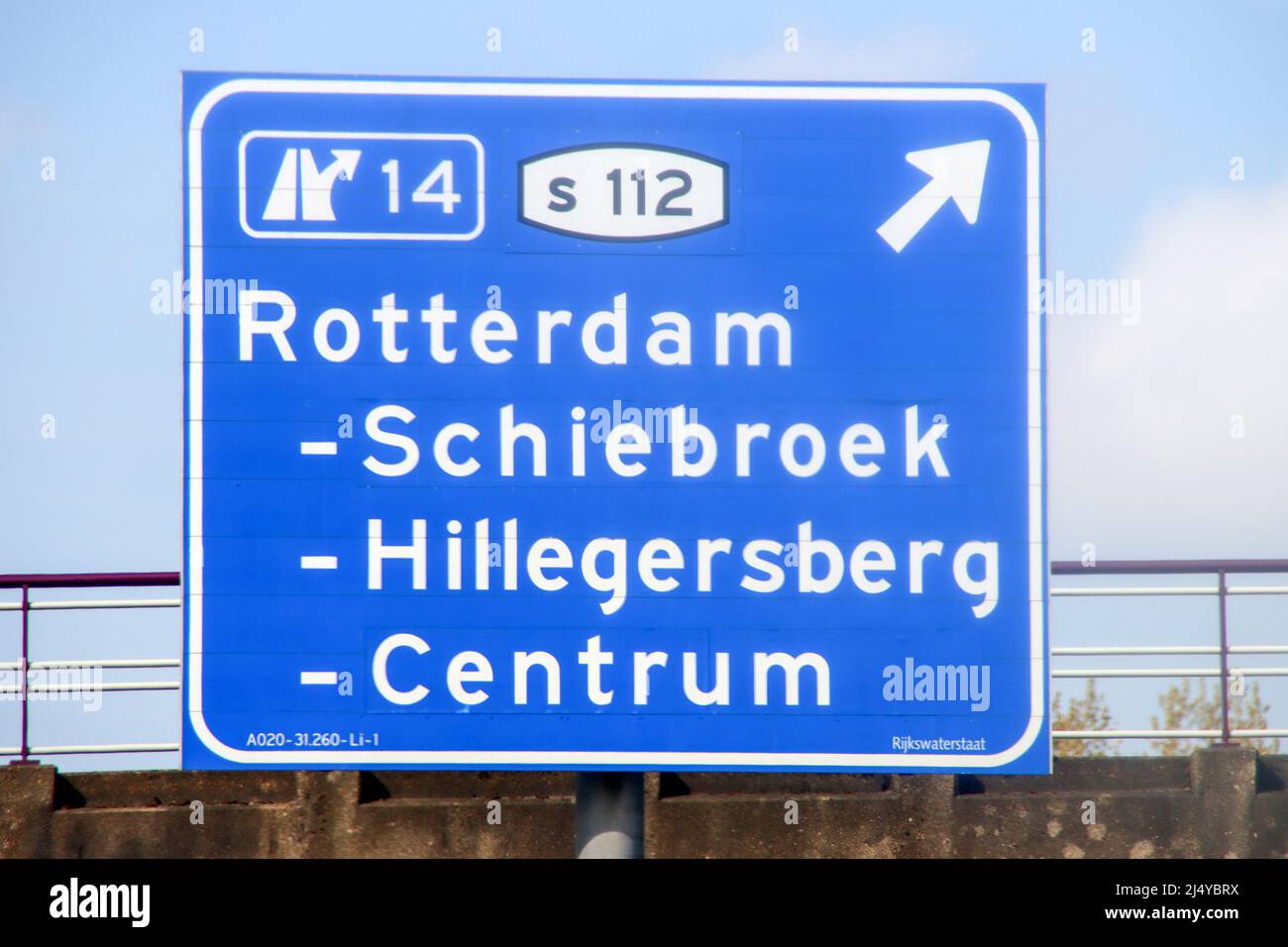 Blue direction and information sign for the directions on Motorway A20 heading to junction 14 S112 to Schiebroek, Hillegersberg and Centrum in Rotterd Stock Photo