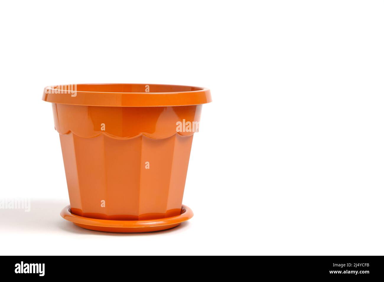 Brown, plastic, empty flower pot on a white background Stock Photo