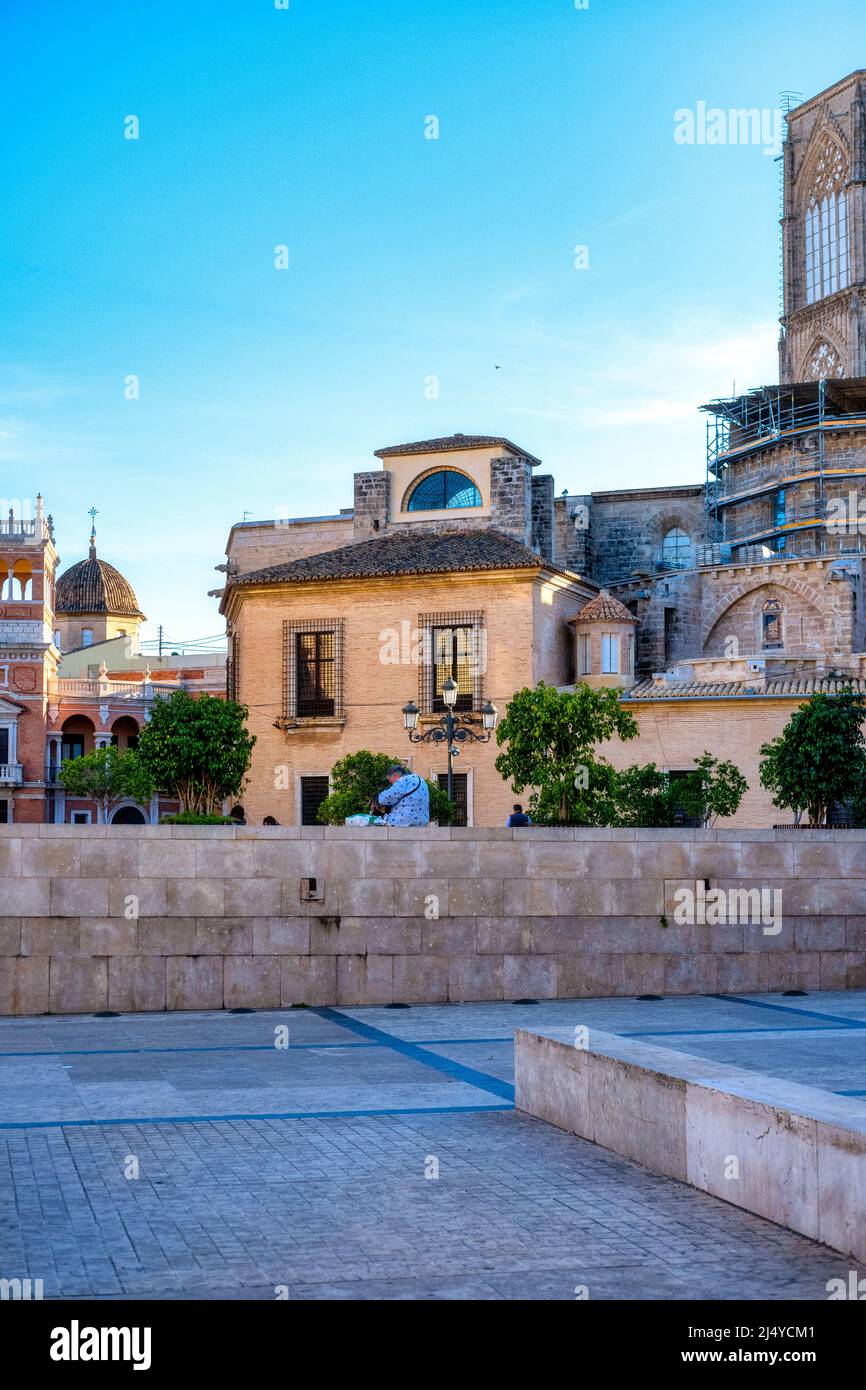 Part of the architecture of the Valencia Cathedral (right) is contrasted with old houses in the old town. This area is a major tourist attraction. Val Stock Photo