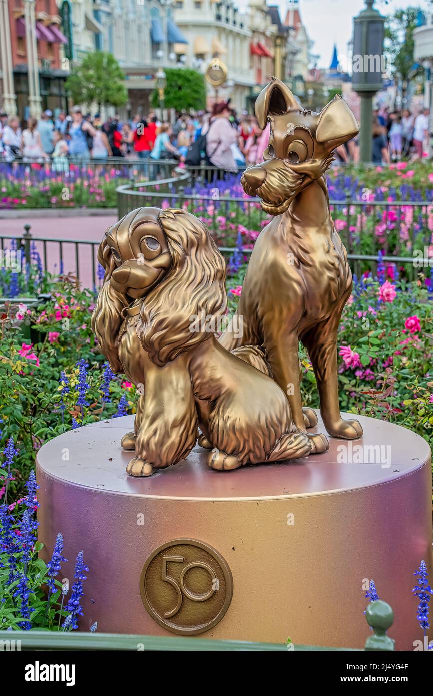 Lady and the Tramp Gold Statue 50th Anniversary Disney Magic Kingdom Stock Photo