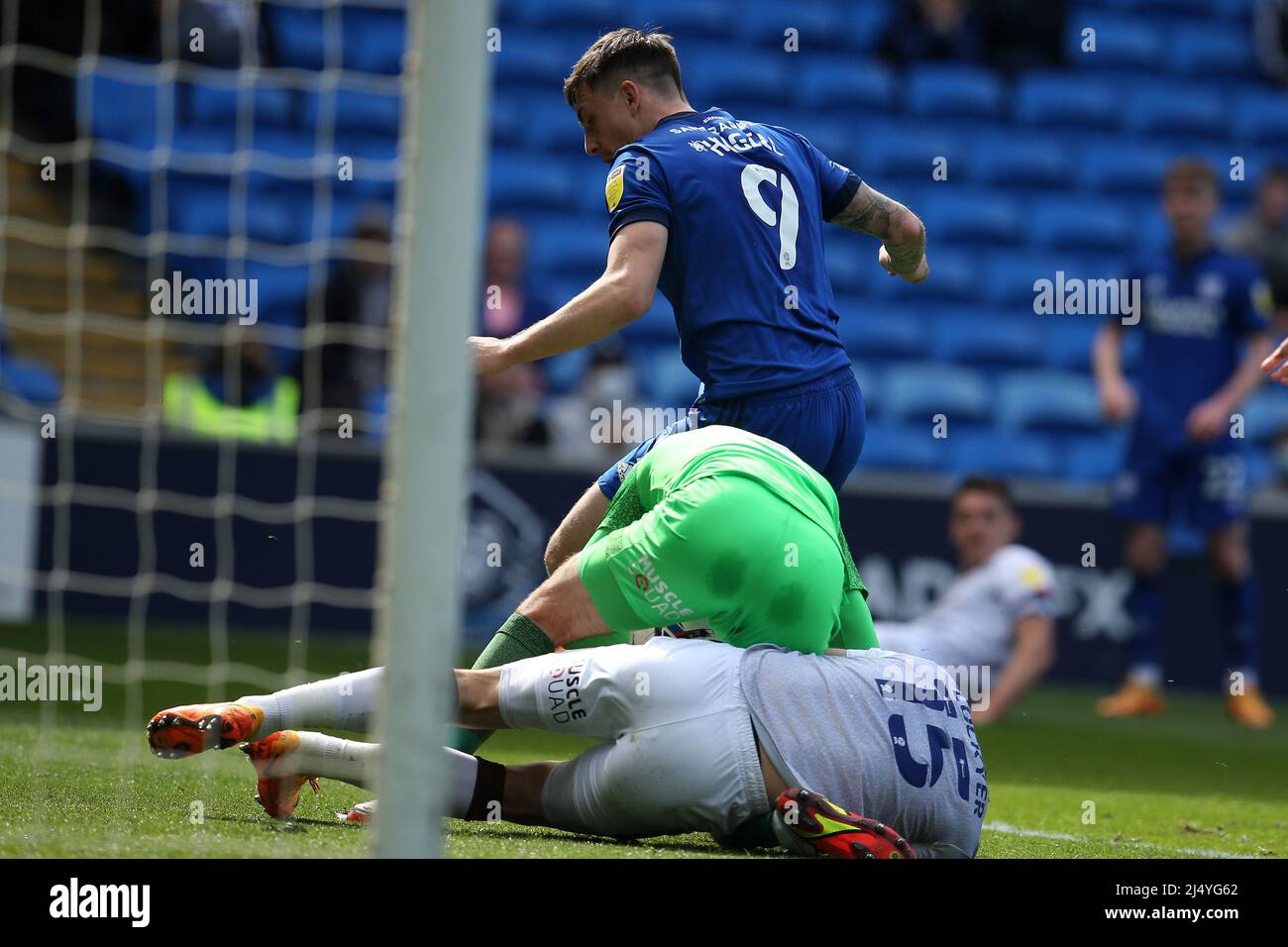 Cardiff, UK. 18th Apr, 2022. James Shea, the goalkeeper of Luton Town is injured during a collision with teammate Tom Lockyer of Luton Town (15). EFL Skybet championship match, Cardiff city v Luton Town at the Cardiff City Stadium in Cardiff, Wales on Easter Monday 18th April 2022. this image may only be used for Editorial purposes. Editorial use only, license required for commercial use. No use in betting, games or a single club/league/player publications. pic by Andrew Orchard/Andrew Orchard sports photography/Alamy Live news Credit: Andrew Orchard sports photography/Alamy Live News Stock Photo