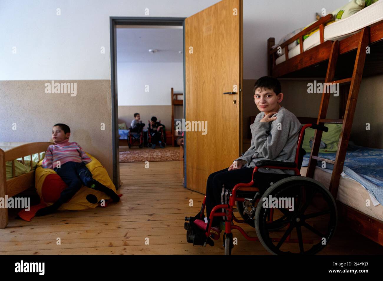 VILSHANY, UKRAINE - APRIL 15, 2022 - Children with special needs who were evacuated from facilities in Zhytomyr Region and Kryvyi Rih stay at the boar Stock Photo