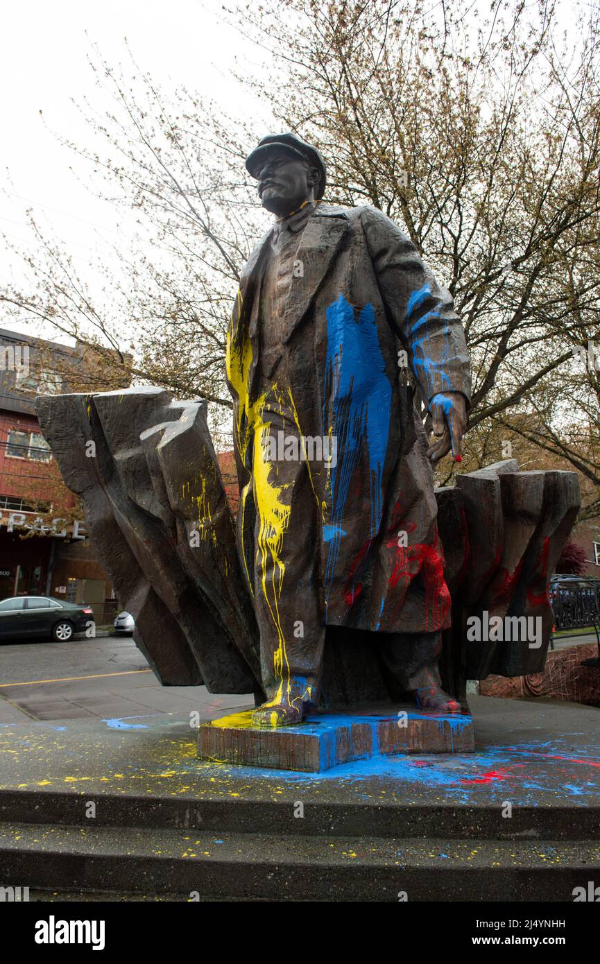 Blue and yellow painted Statue of Vladimir Lenin in the Fremont neighborhood of Seattle, Washington, USA. Lenin painted in Ukrainian flag colors. Stock Photo