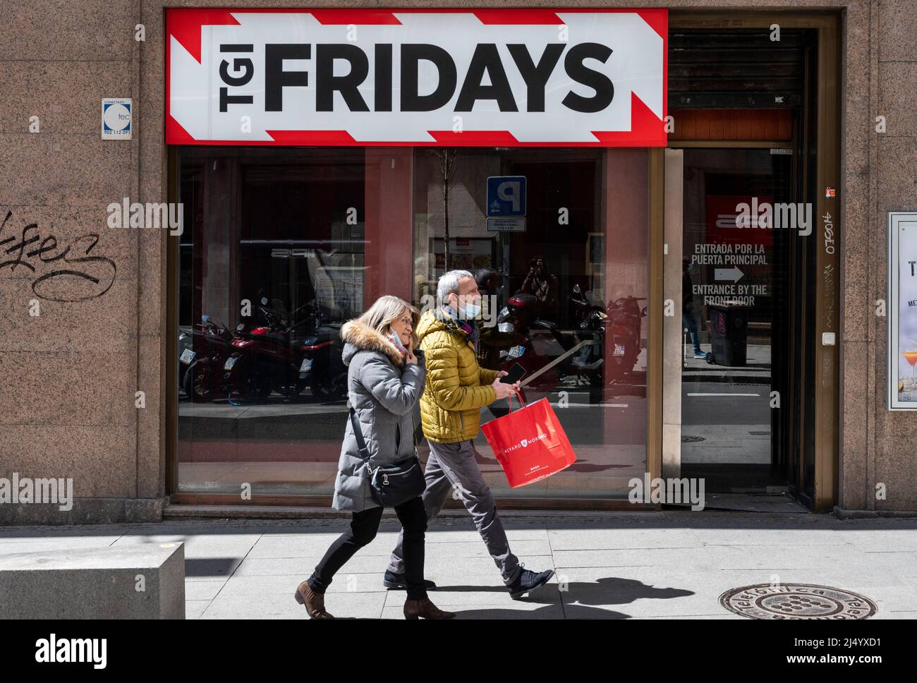 Pedestrians walk past the American casual dining restaurant chain TGI  Fridays in Spain. (Photo by Xavi Lopez/ SOPA Images/Sipa USA Stock Photo -  Alamy