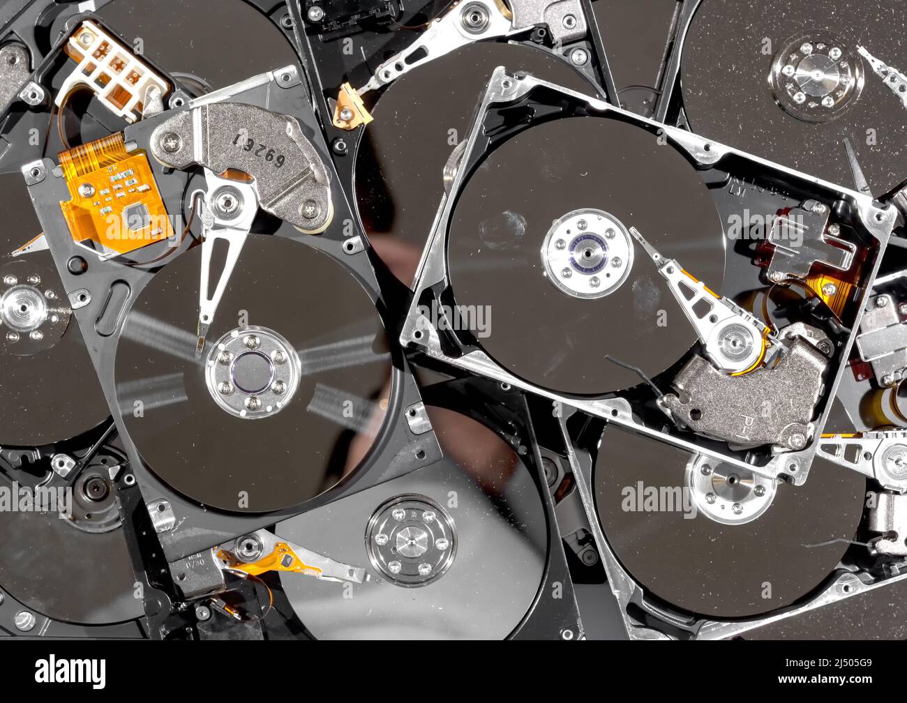 Computer hard drives being recycled. The drives have the tops removed