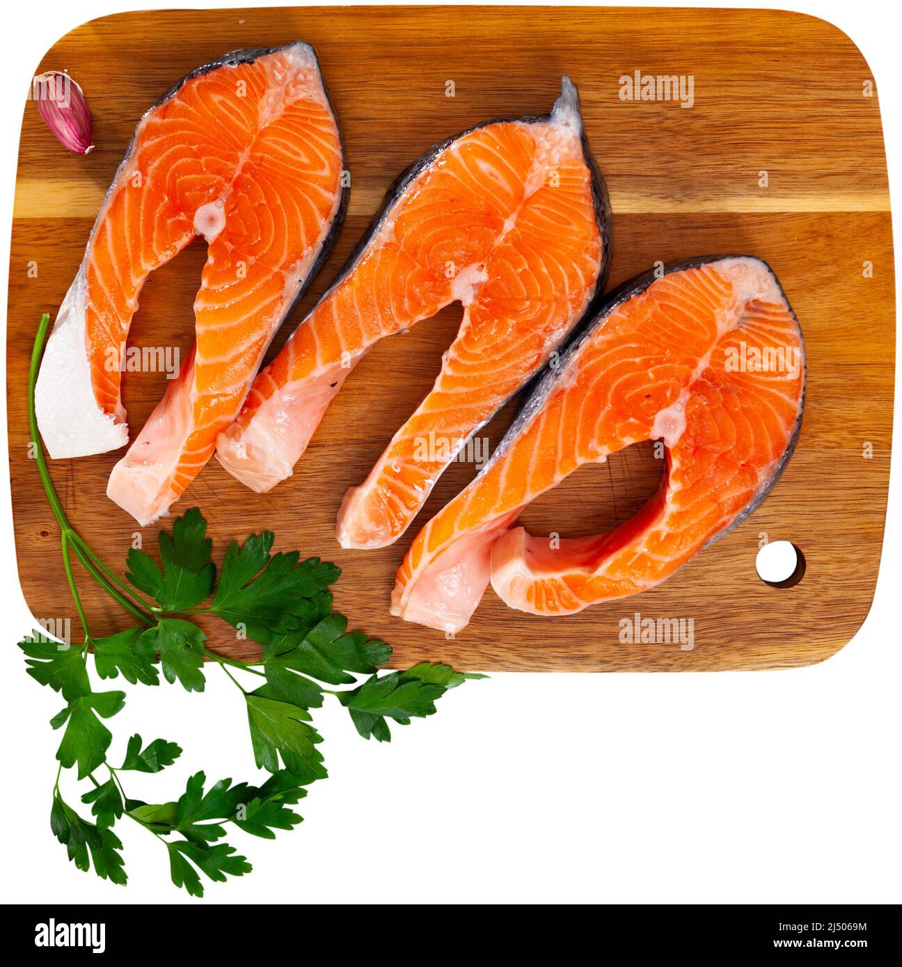 Raw salmon steaks with lemon, parsley, garlic Stock Photo Alamy