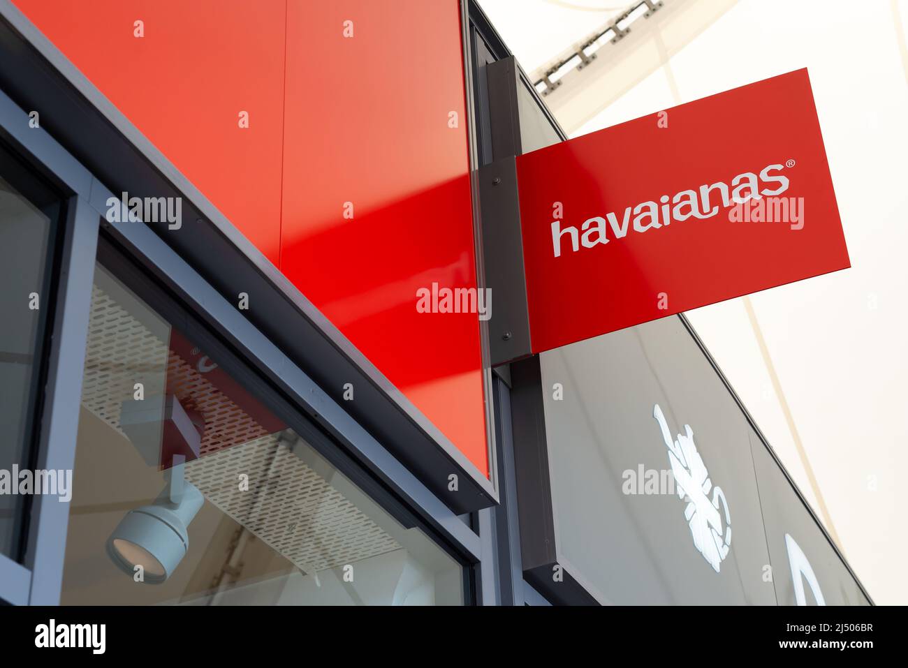 Red overhead Havaianas store sign sign at Ashford Outlet Center, Kent, England. Stock Photo