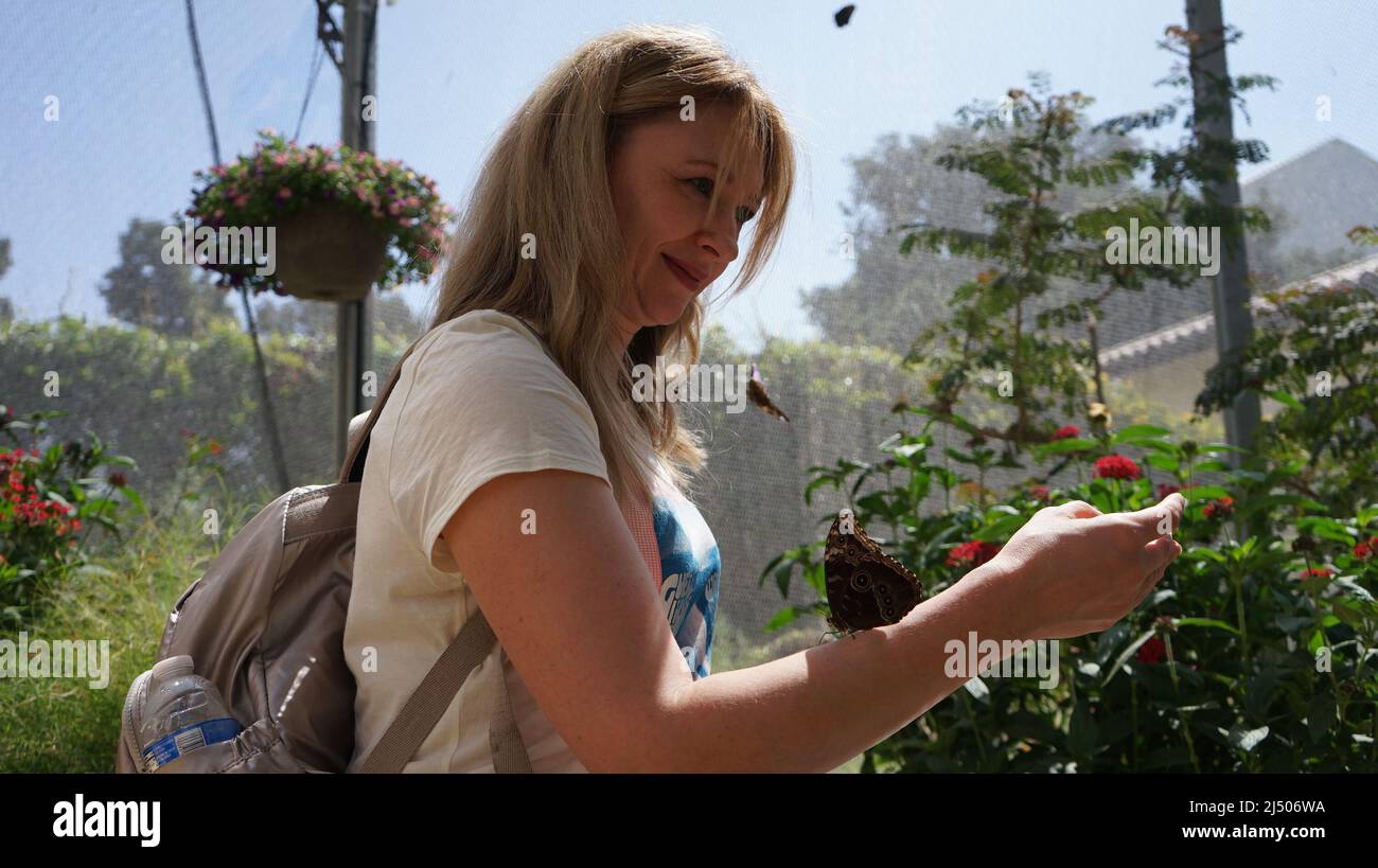 Los Angeles, USA. 18th Apr, 2022. A woman visits a butterfly exhibition