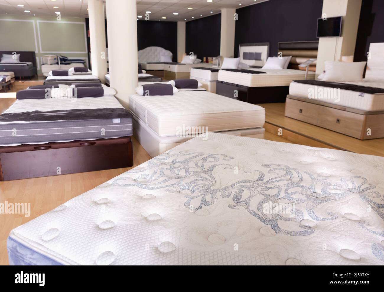Furniture showroom interior new mattresses and beds Stock Photo Alamy