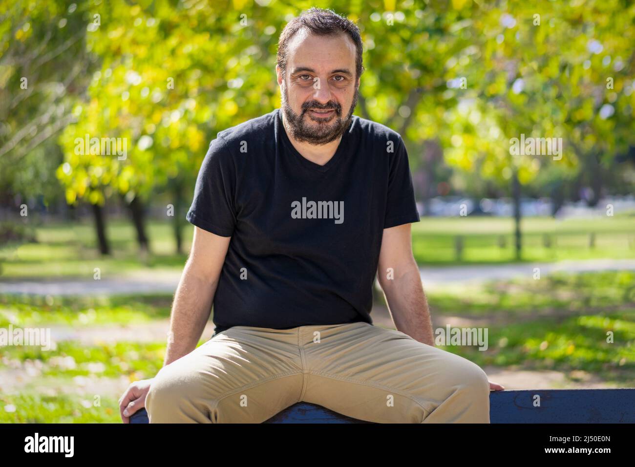 Mature man sitting outdoors hi-res stock photography and images - Alamy