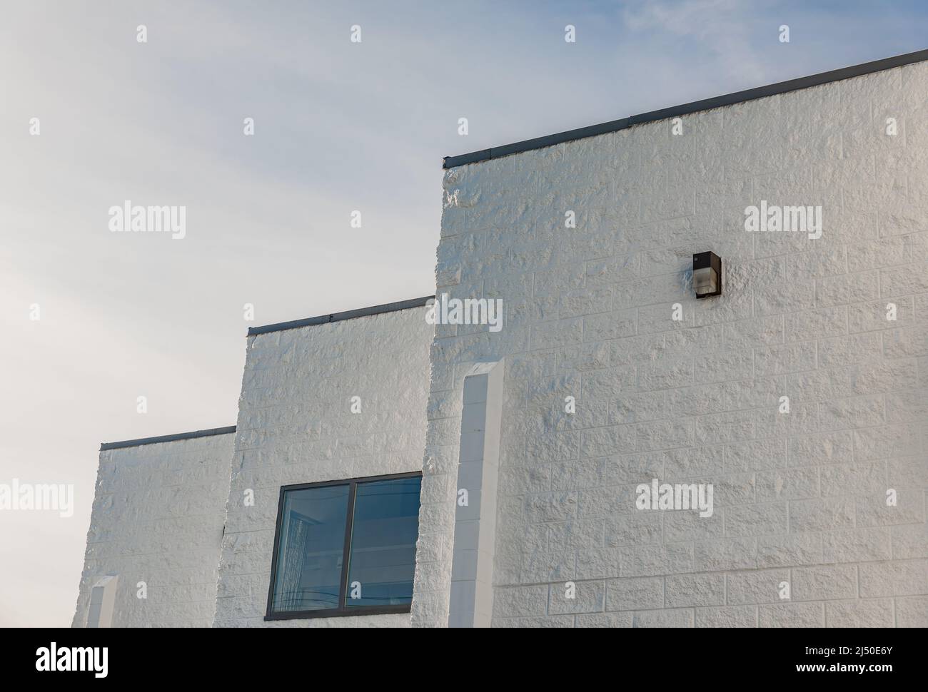 Abstract architecture against sky. Modern white building against a sky. Street photo, nobody, copy space for text Stock Photo