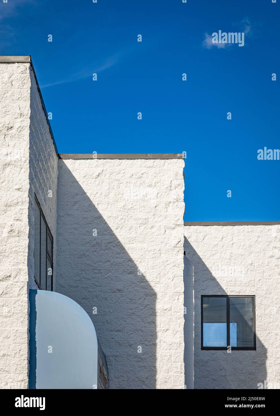 Abstract architecture against blue sky. Modern white building against a blue sky. Street photo, nobody, copy space for text Stock Photo