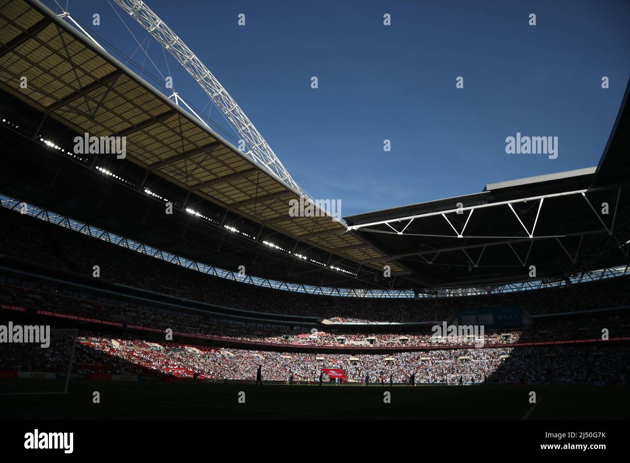 London, UK. 16th Apr, 2022. Silhouettes of players at a sunny Emirates
