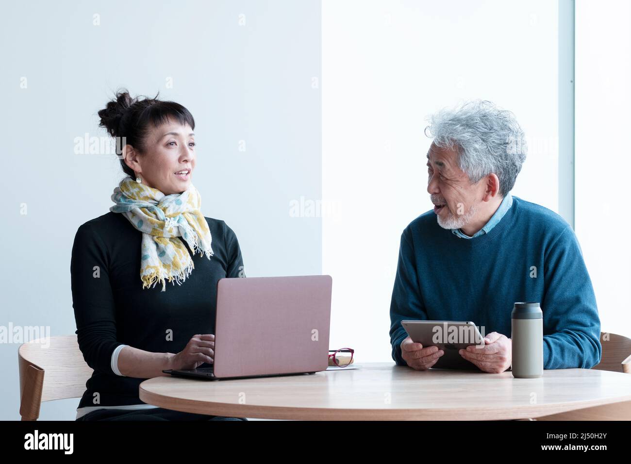 Man and Woman Having a Meeting Stock Photo - Alamy