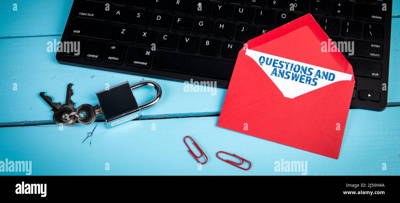 Questions and Answers. Black computer keyboard on office desk Stock
