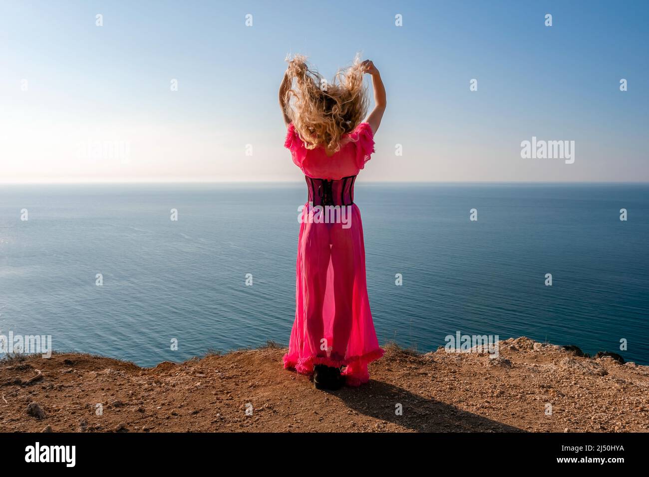 Close up shot of beautiful young caucasian woman with curly blond hair ...