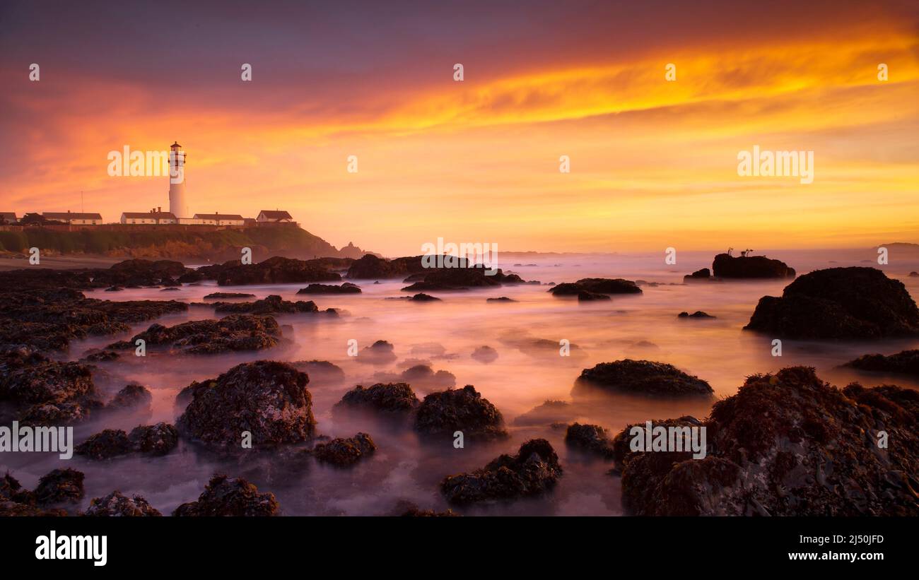 Pigeon Point lighthouse in Pescadero, CA at sunset - view from North shoreline Stock Photo