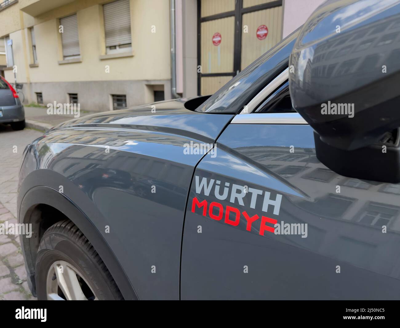 Paris, France - Apr 10 2022: Side view of car with logotype of Wurth Modyf  workwear and safety shoes manufacturer Stock Photo - Alamy