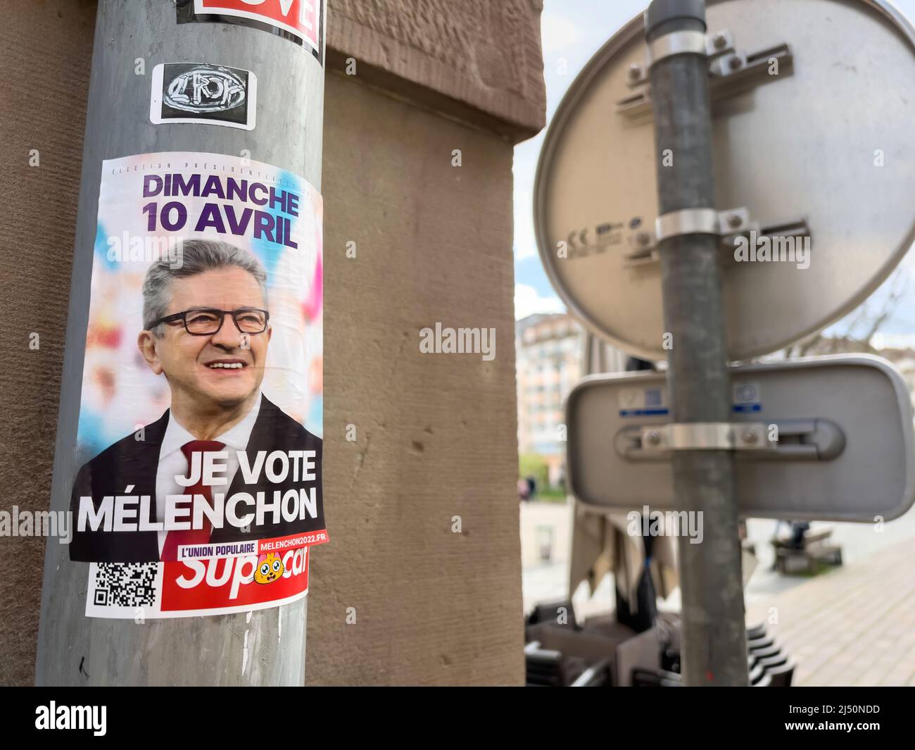 Paris, France - Apr 10 2022: Sunday, 10 April, I vote Melenchon sticker on city building in the day the first round of France 2022 presidential election Stock Photo
