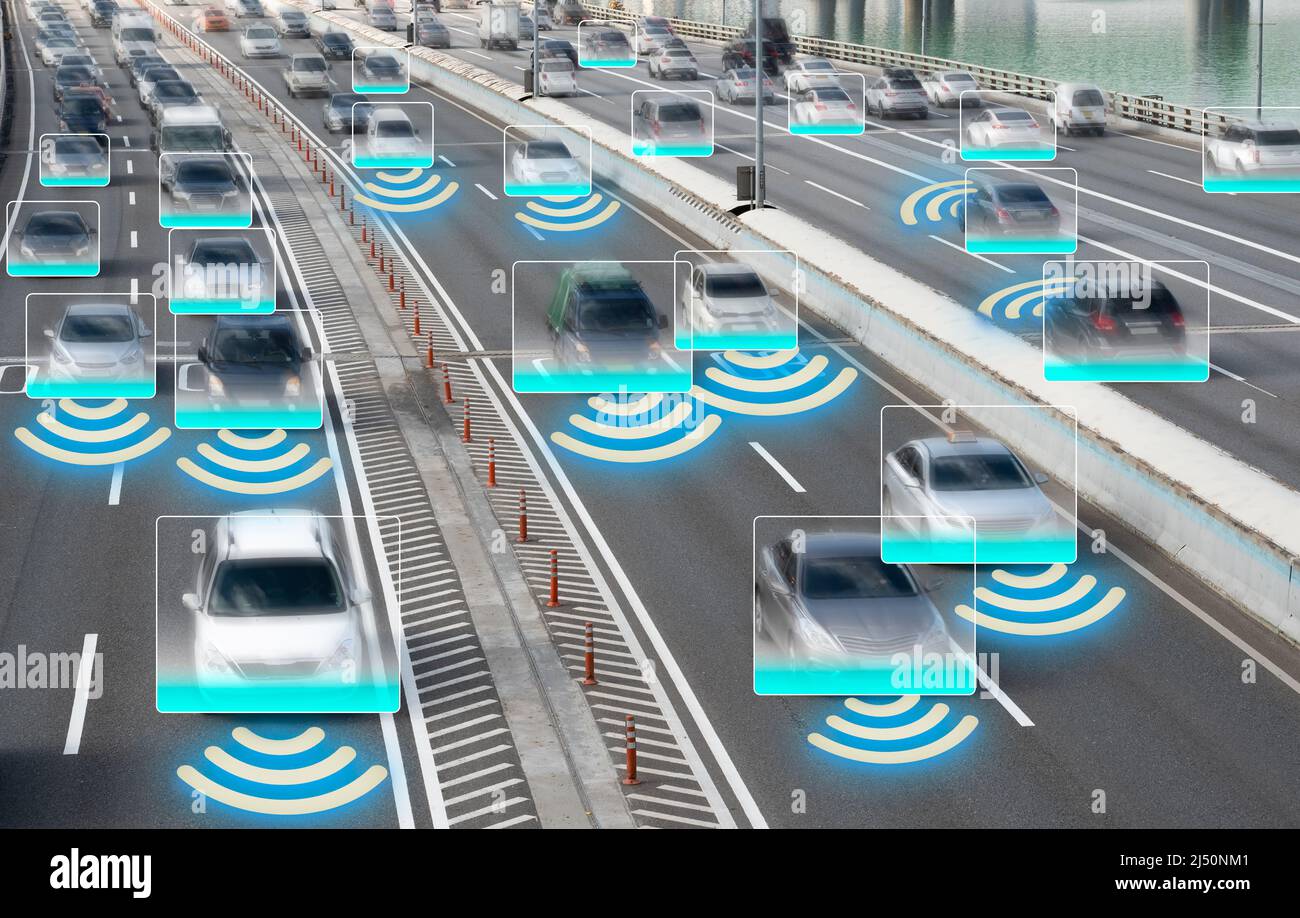 Autonomous Self Driving Cars Moving Through City. Stock Photo