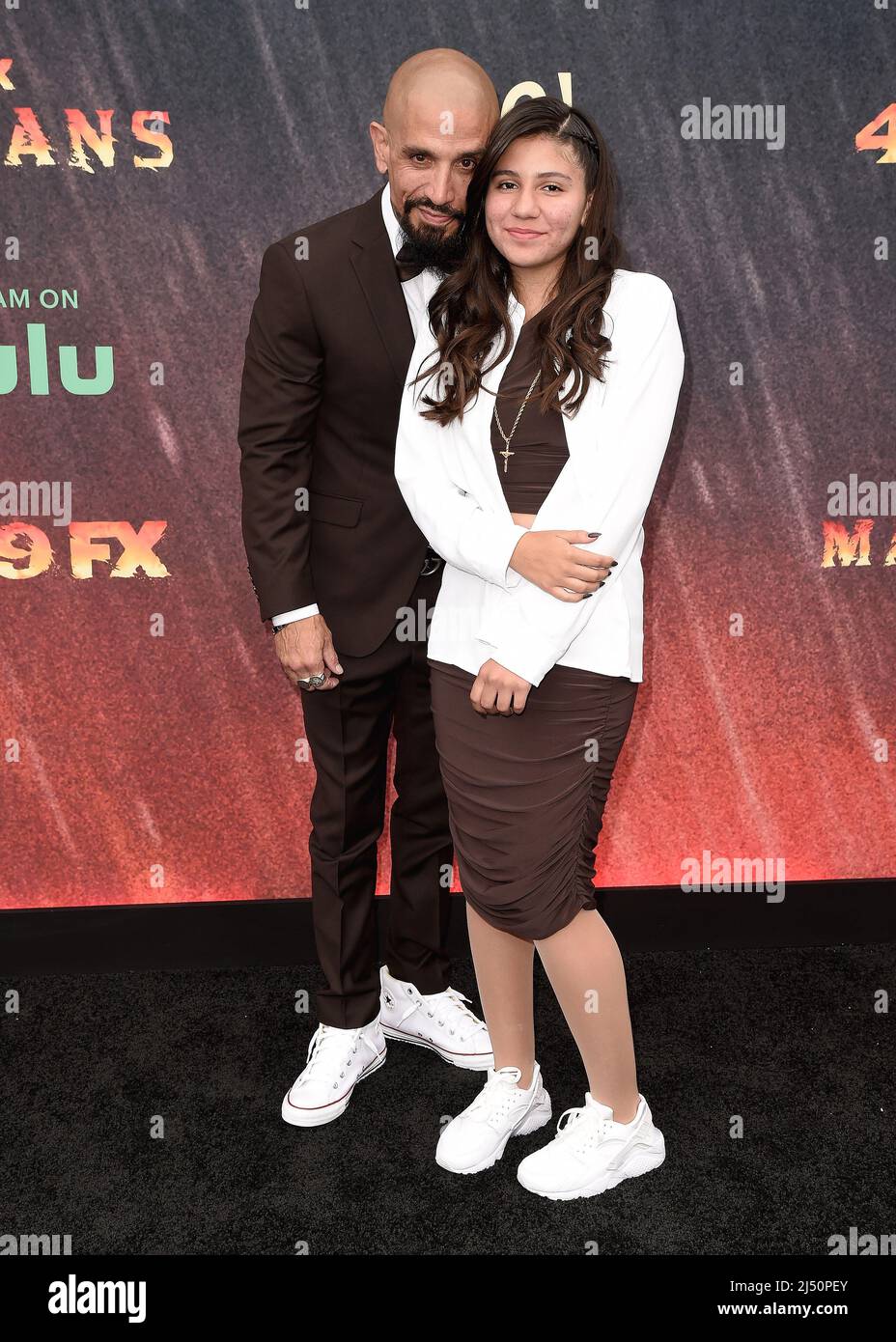 Joseph Lucero and daughter Brooklyn Lucero walking on the red carpet at
