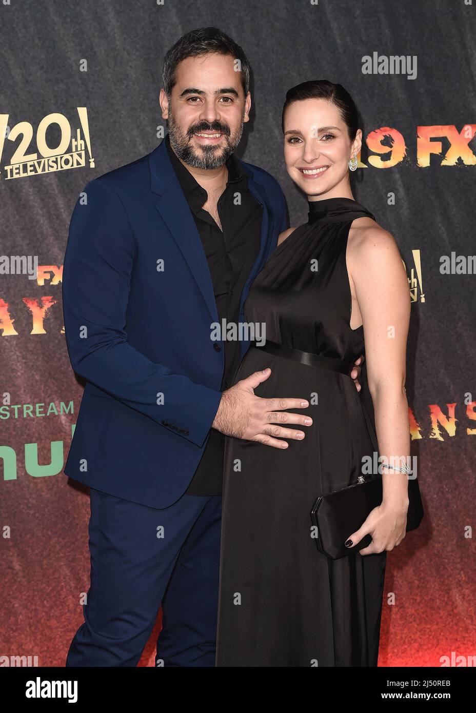 Guillermo Garcia and Carla Baratta walking on the red carpet at FX's