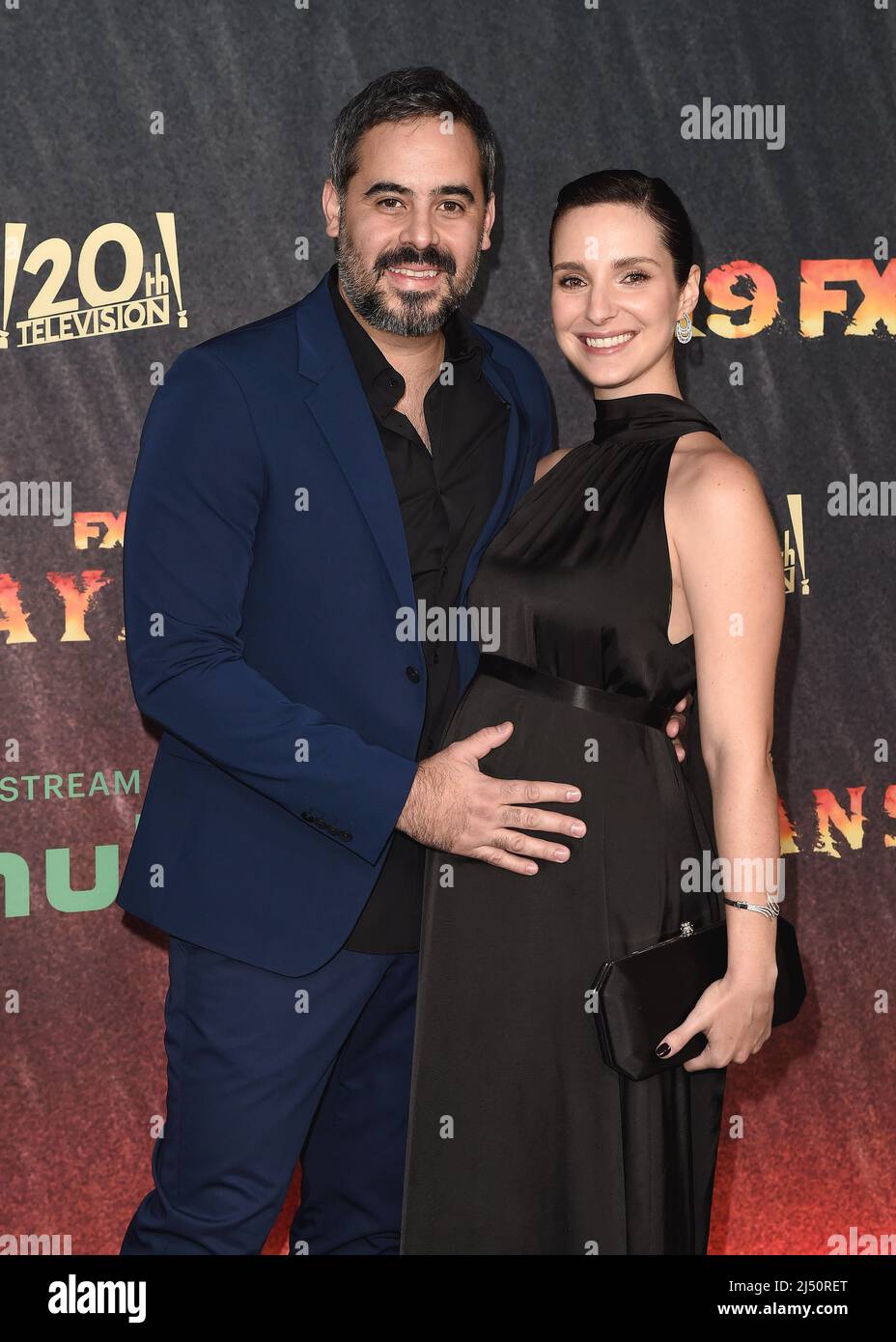 Guillermo Garcia and Carla Baratta walking on the red carpet at FX's