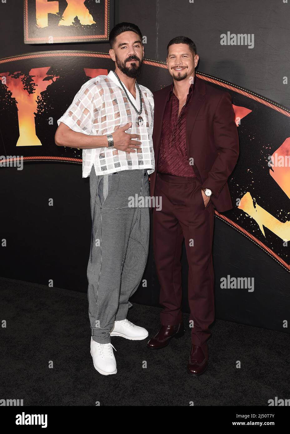 Clayton Cardenas and JD Pardo walking on the red carpet at FX's "Mayans