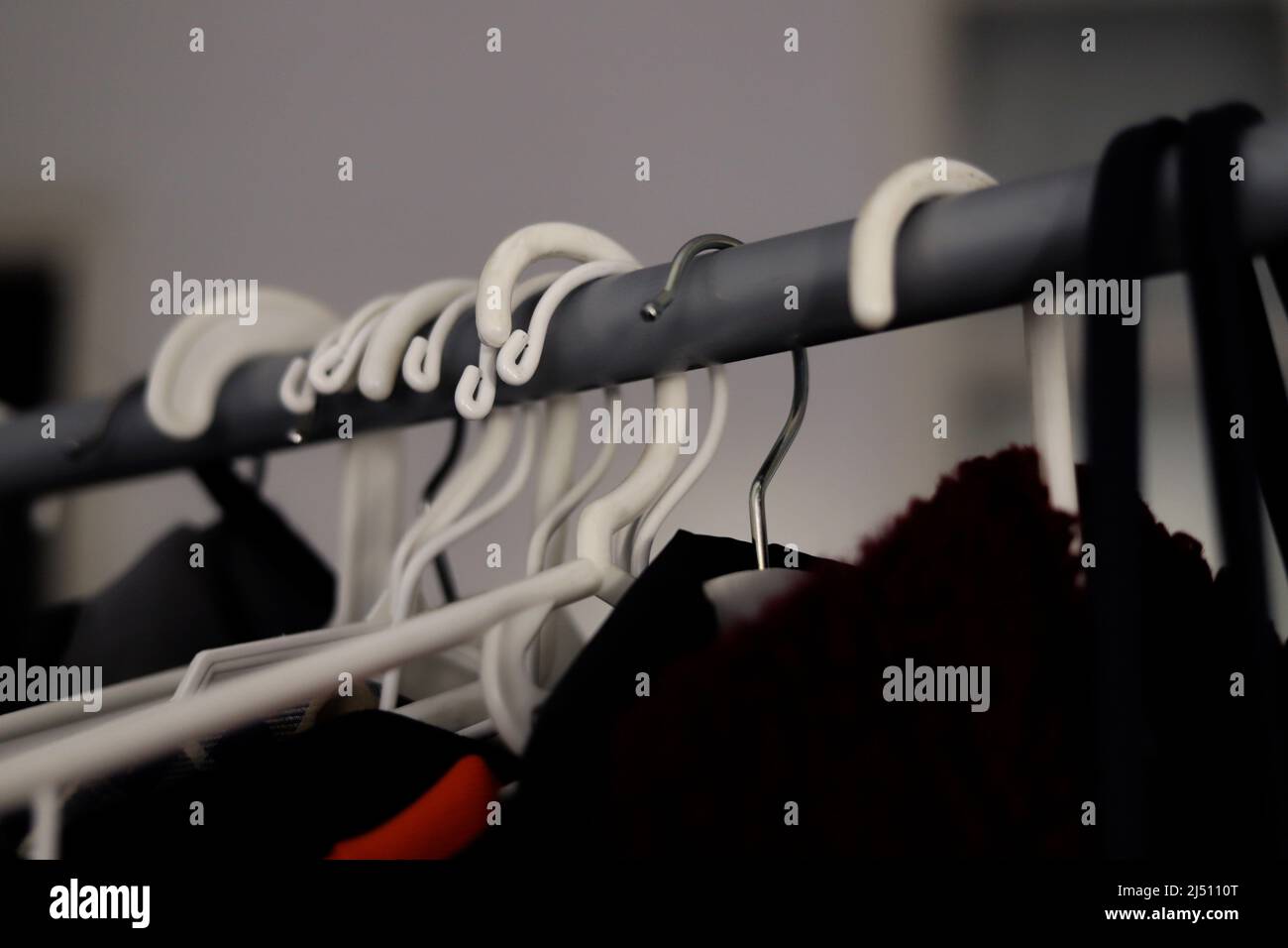detail of different types of hangers on racks with clothing Stock Photo