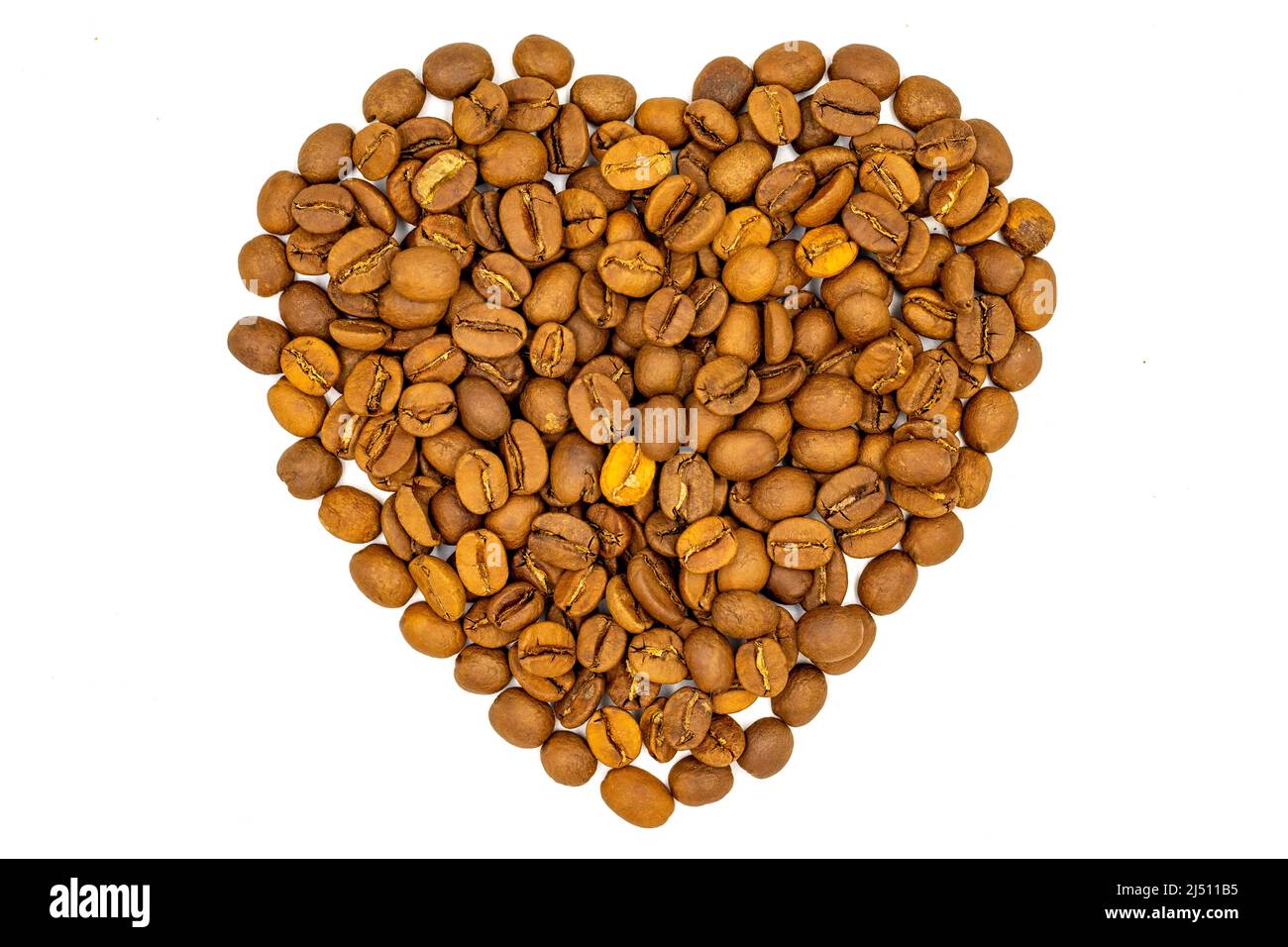 Coffee beans isolated on a white background. Heart shape with coffee beans. Close-up. Top view Stock Photo