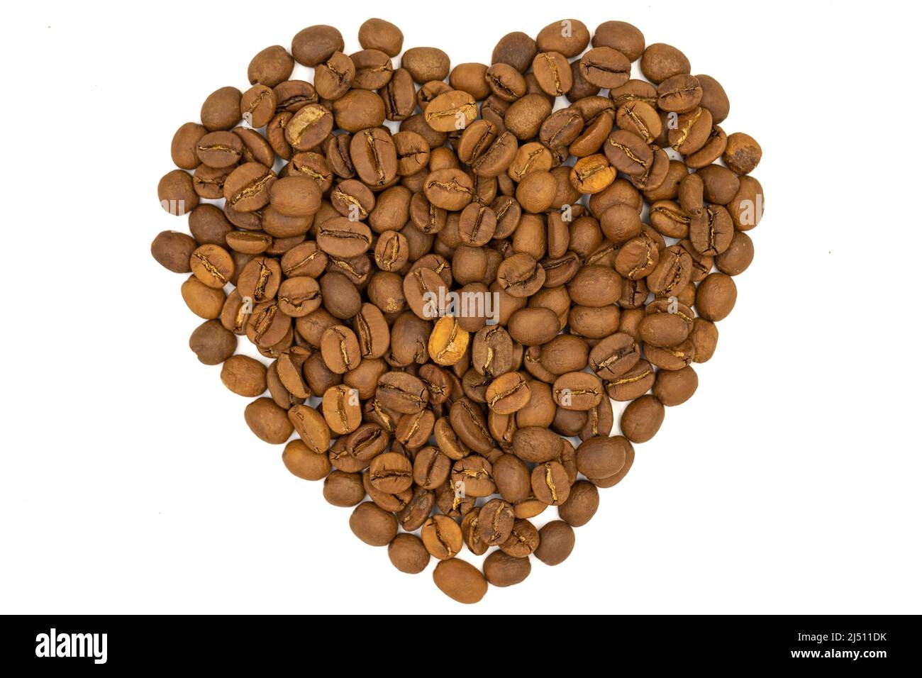 Coffee beans isolated on a white background. Heart shape with coffee beans. Close-up. Top view Stock Photo
