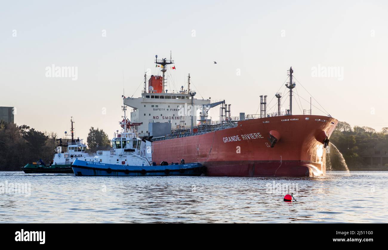 Cork Harbour, Cork, Ireland. 19th April, 2022. Tanker Grande Riviere with a cargo of Methanol is assisted by tug boats Gerry O' Sullivan and Alex to make a turing manoeuvre at the Belvelly Port Facility, Cork, Ireland. - Credit; David Creedon / Alamy Live News Stock Photo
