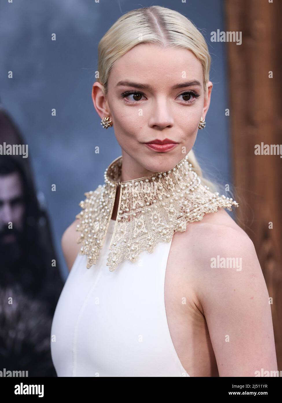 HOLLYWOOD, LOS ANGELES, CALIFORNIA, USA - APRIL 18: Actress Anya Taylor-Joy  wearing a Dior dress and gold collar necklace with a Tiffany and Co.  bracelet, rings, and earrings arrives at the Los