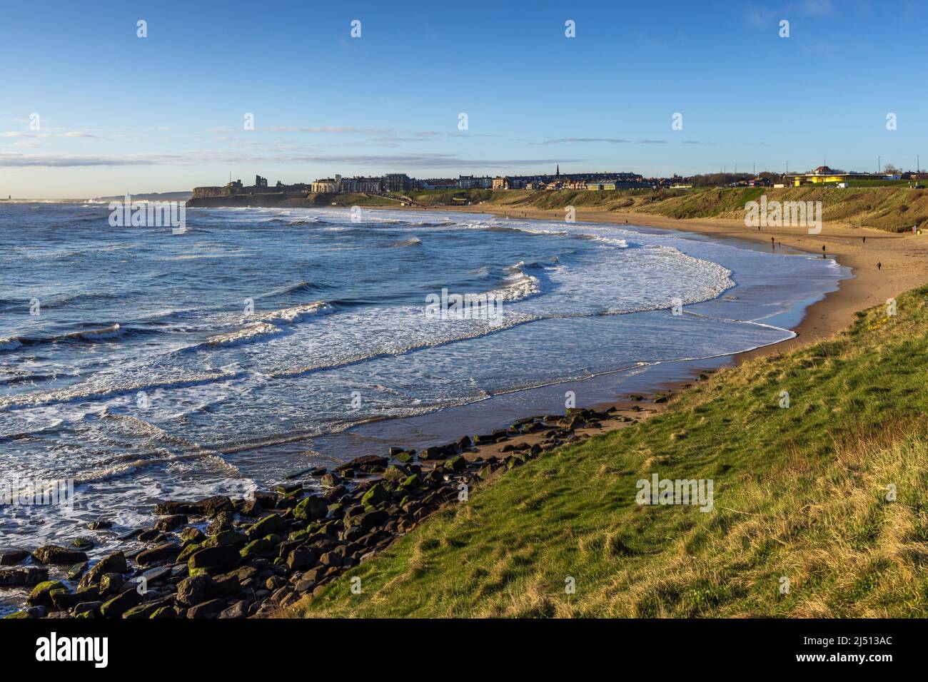 Long Sands beach at Tynemouth on a early spring morning, with Tynemouth Castle and Priory in the distance, Tyne and Wear. Stock Photo