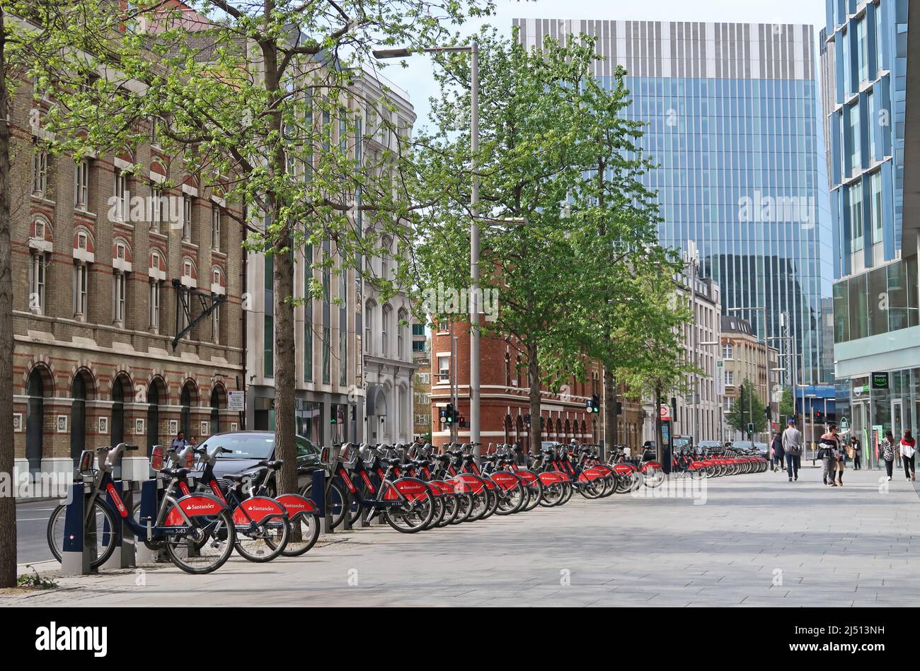 Santander hire bikes (Boris Bikes) in docking stations on Southwark Street, near London Bridge in London, UK Stock Photo