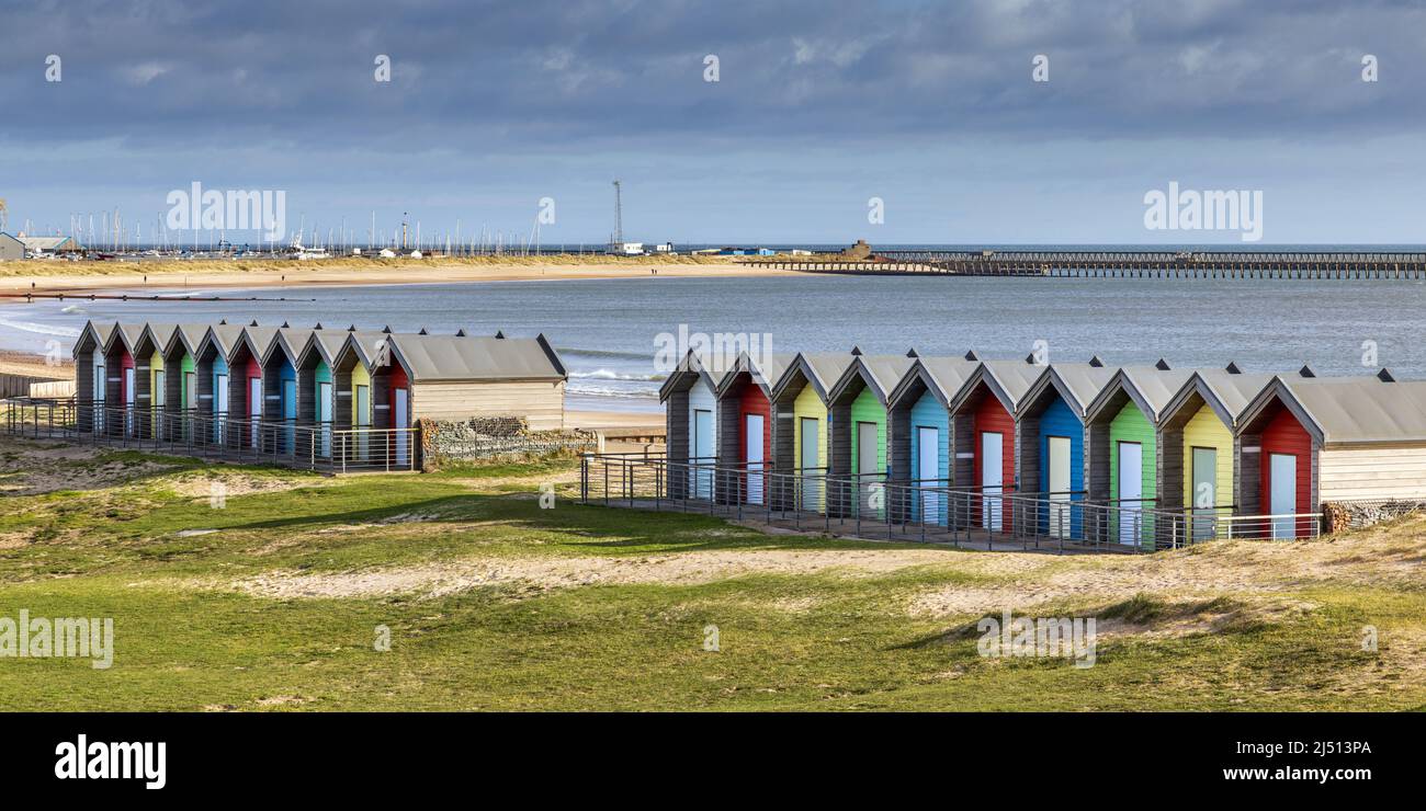 The colourful beach huts on the promenade at Blyth, Northumberland, Uk