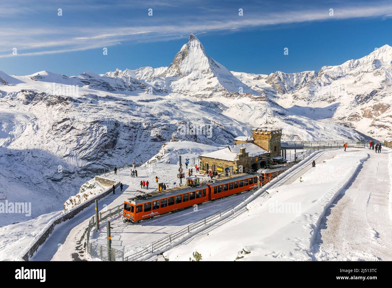 Gornergrat, Zermatt, Switzerland - November 12, 2019: Red cable car train  on snowy railway at summit station with tourists and Matterhorn summit in  wi Stock Photo - Alamy