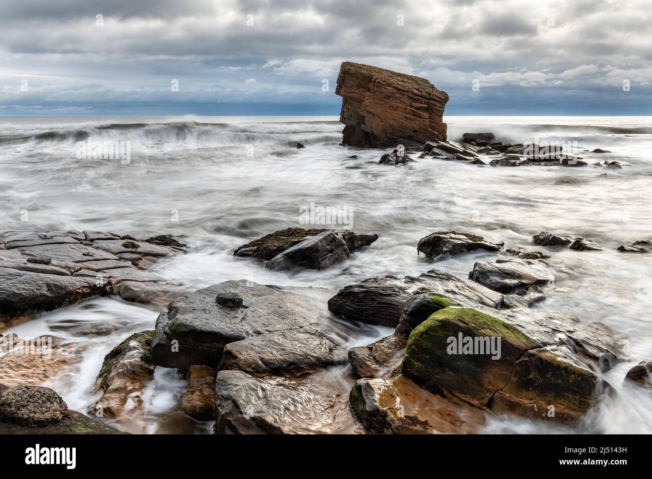 'Charlie's Garden' is a sandstone sea stack in Collywell Bay, Seaton Sluice, Northumberland, Uk Stock Photo