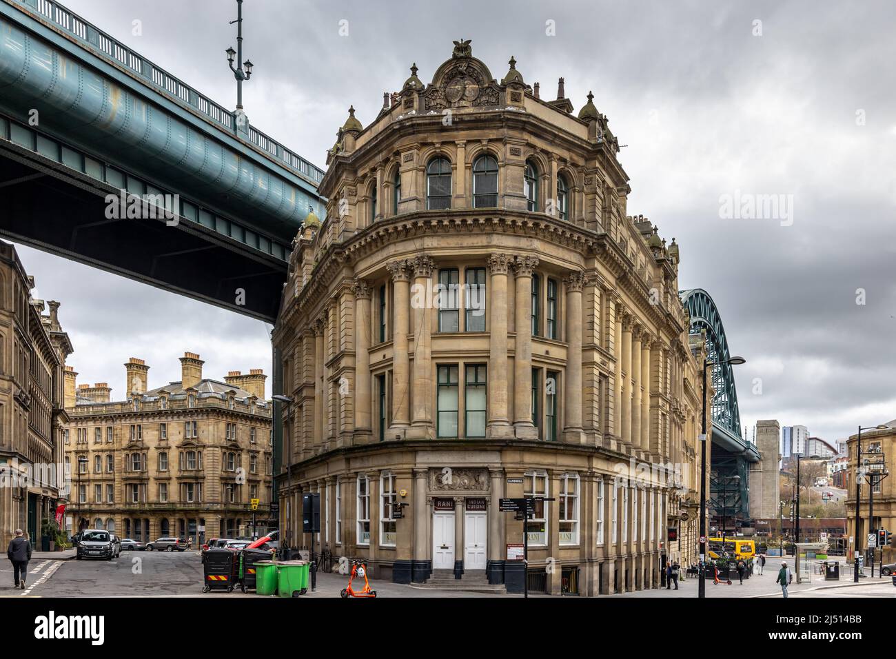 The Tyne Bridge and the neoclassical style Phoenix Apartments building in the old town Sandhill area of Newcastle upon Tyne. Stock Photo