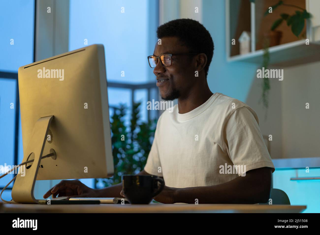 Thoughtful web developer work on computer, programmer trying to find solution for bug in app code Stock Photo