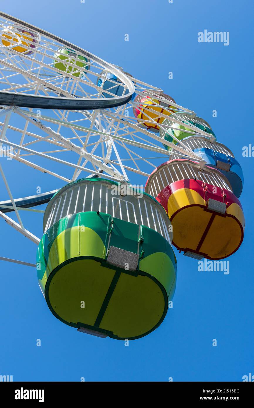 Looking up at colourful ferris wheel carts Stock Photo Alamy