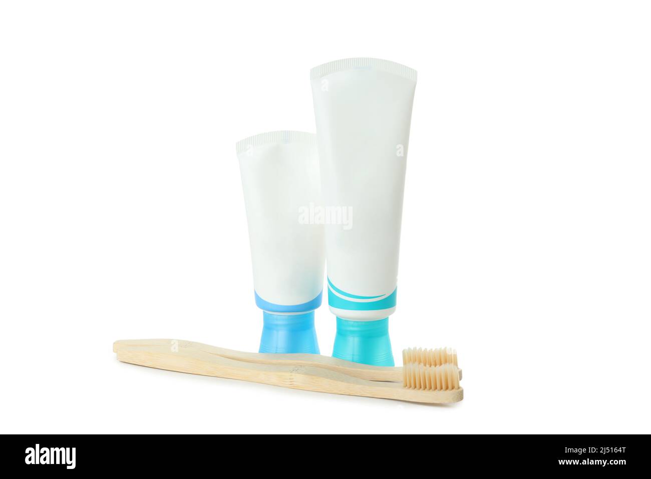 Toothpaste tubes and toothbrushes isolated on white background Stock ...