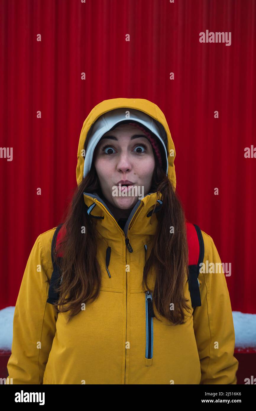 woman facial expression with red background Stock Photo Alamy
